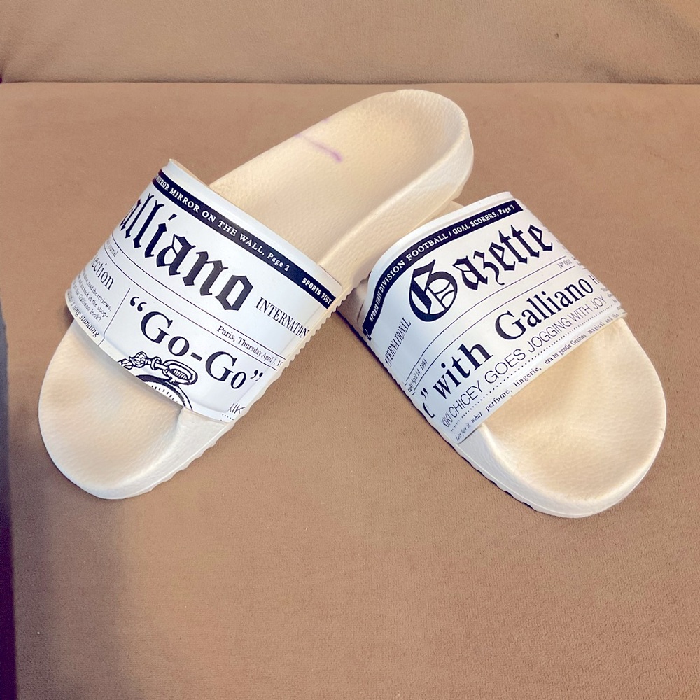 John Galliano white newspaper print Cassandra slides flip flops.